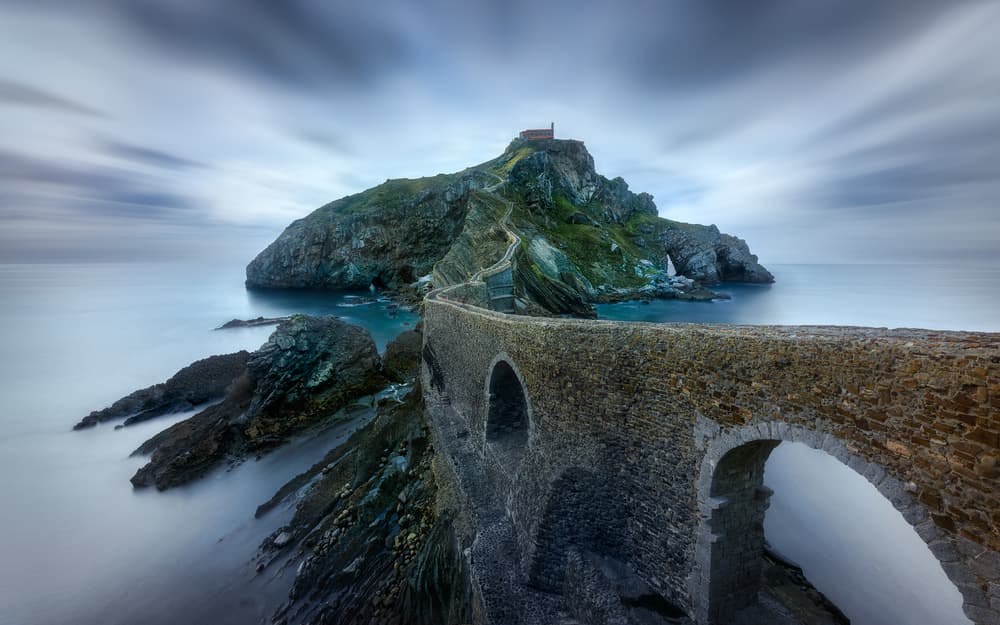 Ancient Island Chapel Bridge by Jesús M. García — canvas wall art