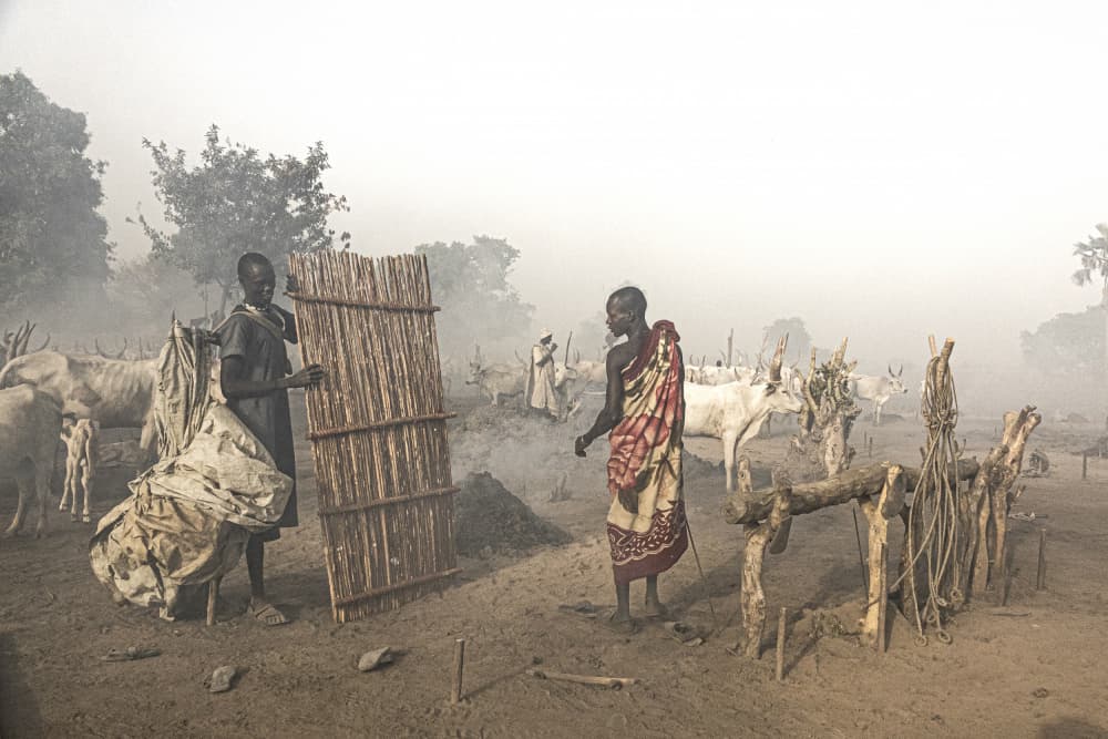 Hazy African Village Life by Elena Molina — canvas wall art