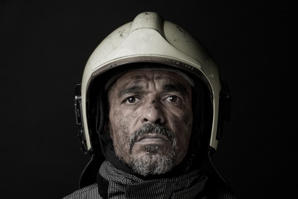 Solemn Firefighter Portrait by Rayco — canvas wall art