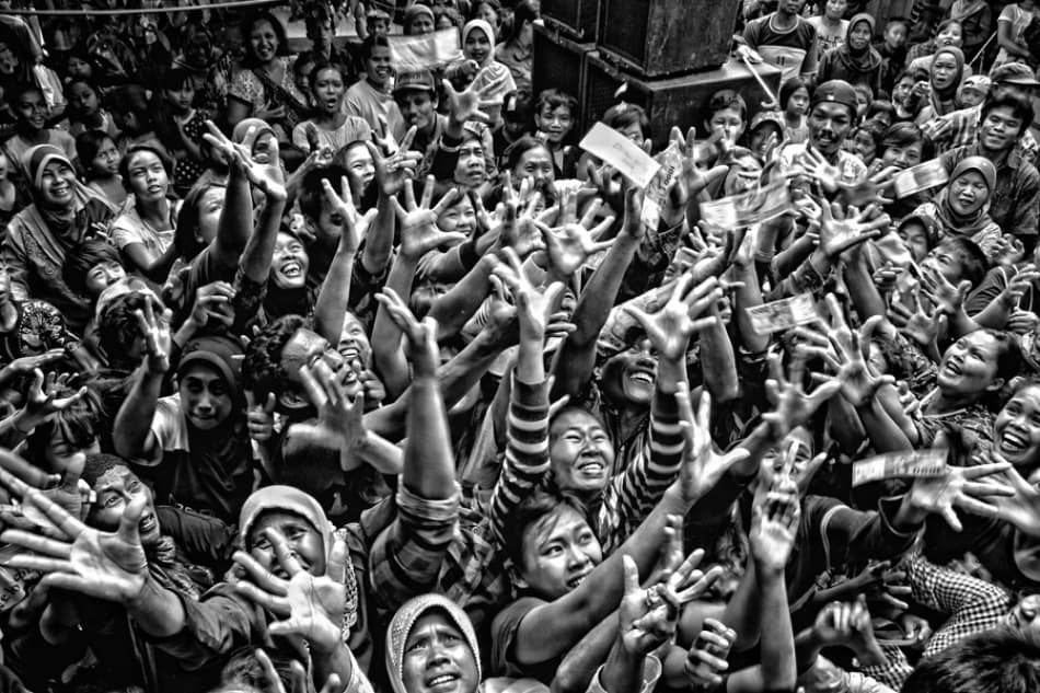 Hands Reaching For Money by m salim bhayangkara — canvas wall art