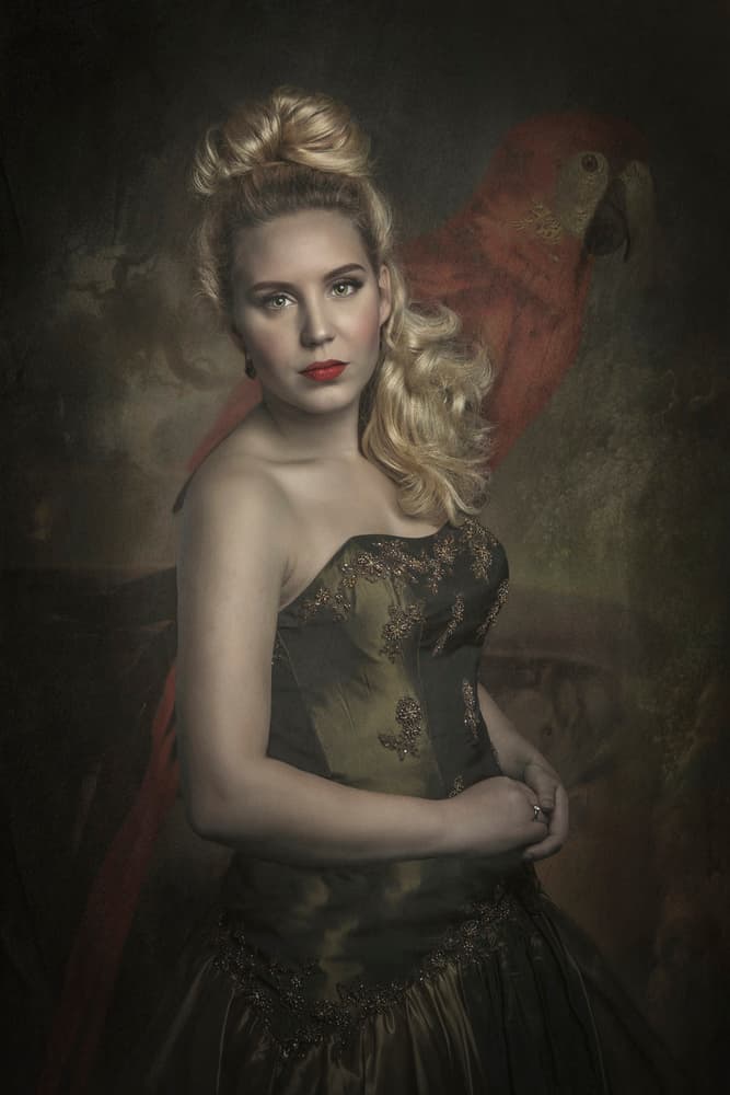 Regal Lady And Red Parrot by Carola Kayen-Mouthaan — canvas wall art