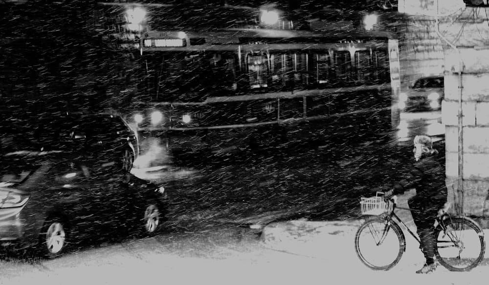 Urban Snowstorm Commute by Jian Wang — canvas wall art