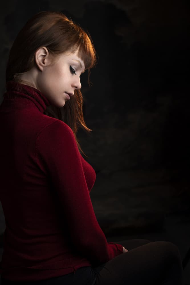 Pensive Woman In Red by Jan Slotboom — canvas wall art