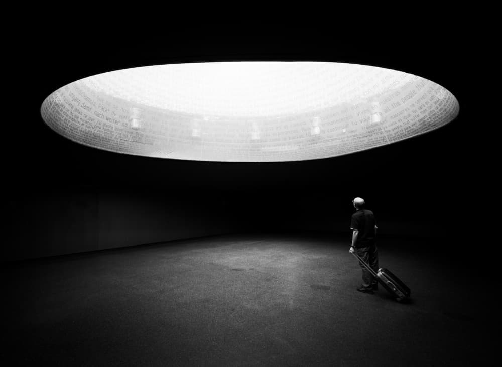 Solitary Traveler Under Light by Paco Palazon — canvas wall art