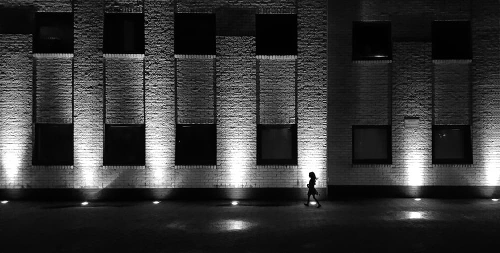 Lone Woman Night Walk by Huib Limberg — canvas wall art