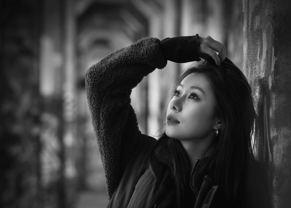Thoughtful Woman In Arches by Vicki Lai — canvas wall art