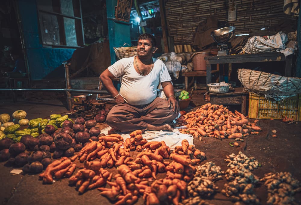Smiling Night Market Vendor by Marco Tagliarino — canvas wall art
