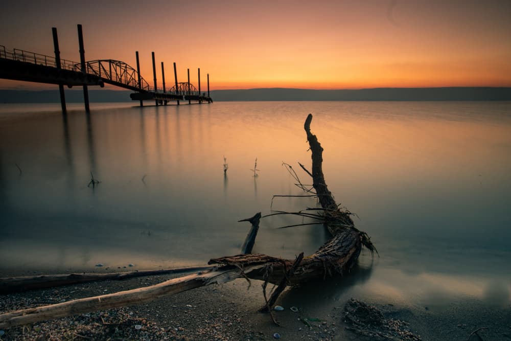 Tranquil Pier Sunset by Wisam Hassan — canvas wall art