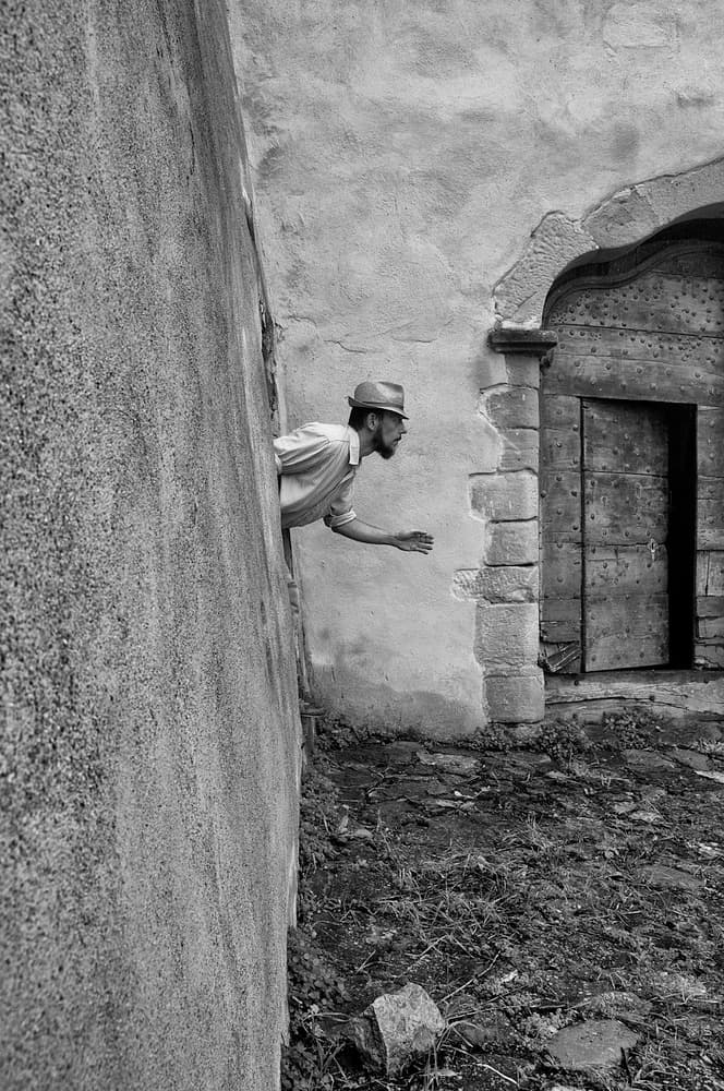 Man Leaning from Wall by Carlo Ferrara — canvas wall art