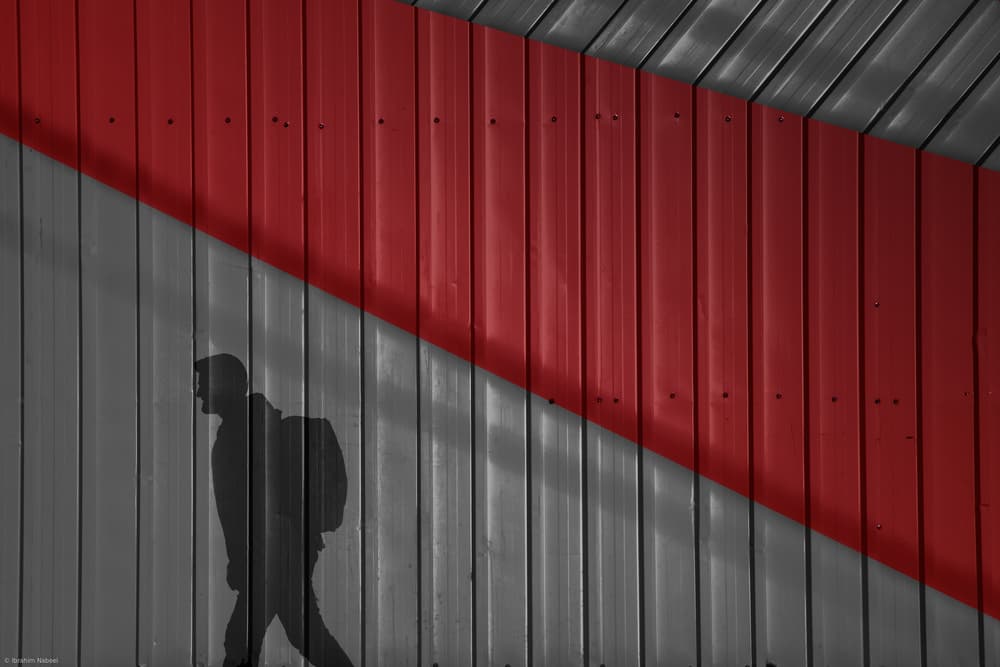 Red Wall Shadow by Ibrahim Nabeel — canvas wall art
