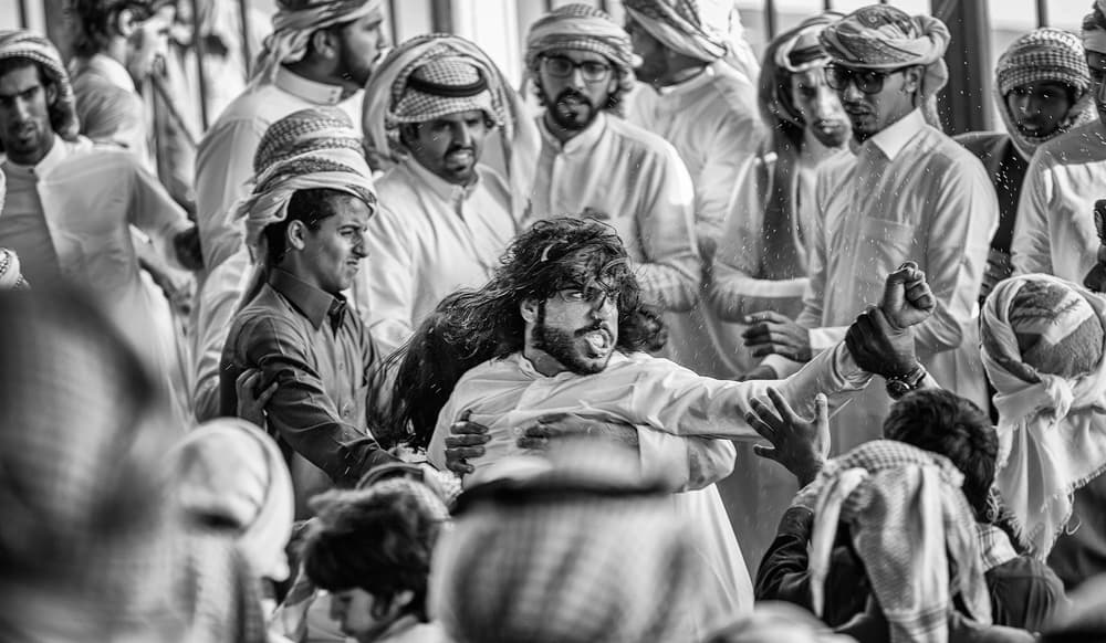 Spirited Arab Men's Gathering by Rami Al Adwan — canvas wall art