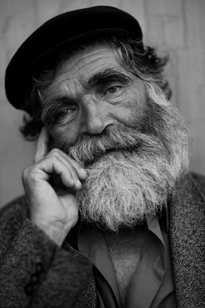 Pensive Older Man Portrait by engin akyurt — canvas wall art