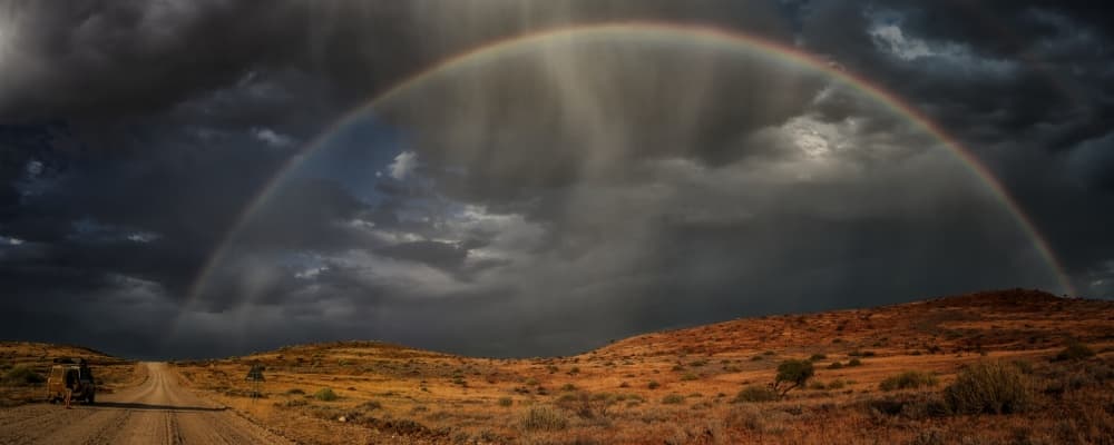 Rainbow Over Desert Road by Pavol Stranak — canvas wall art