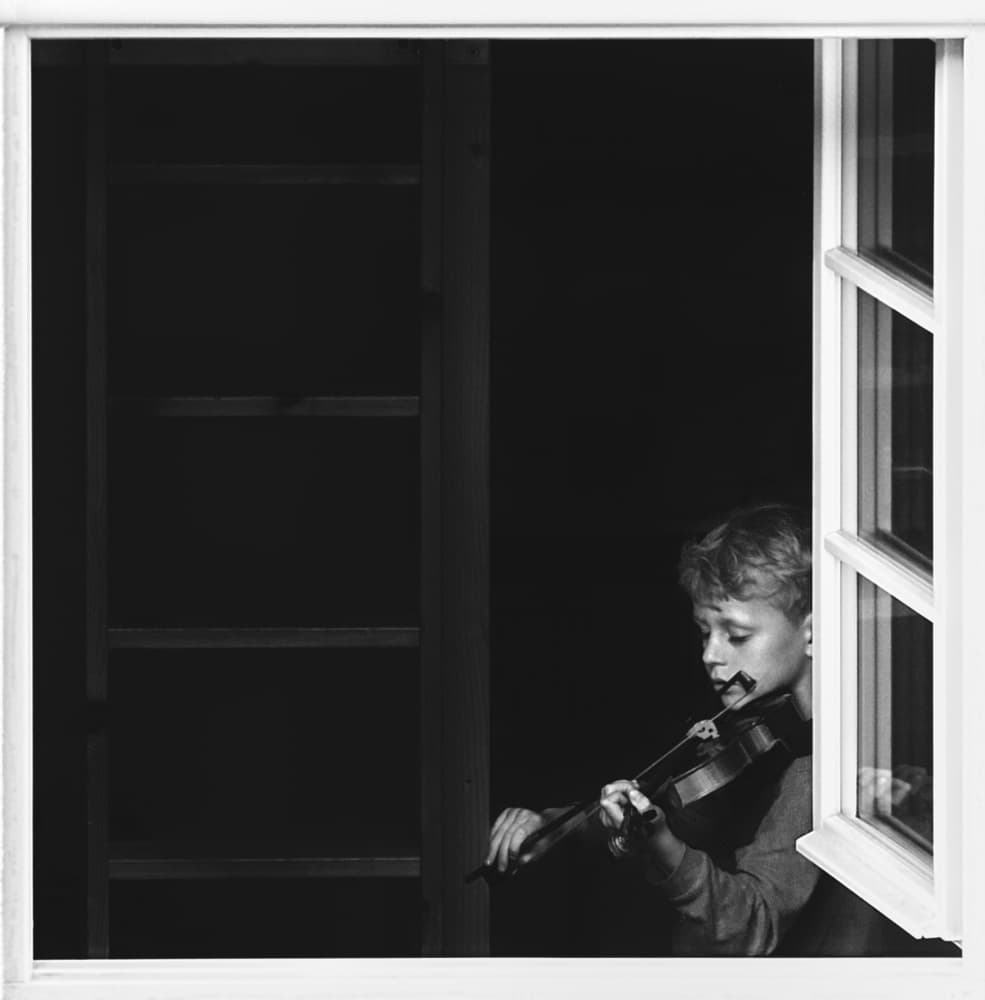Young Musician by Window by Alexander Jikharev — canvas wall art