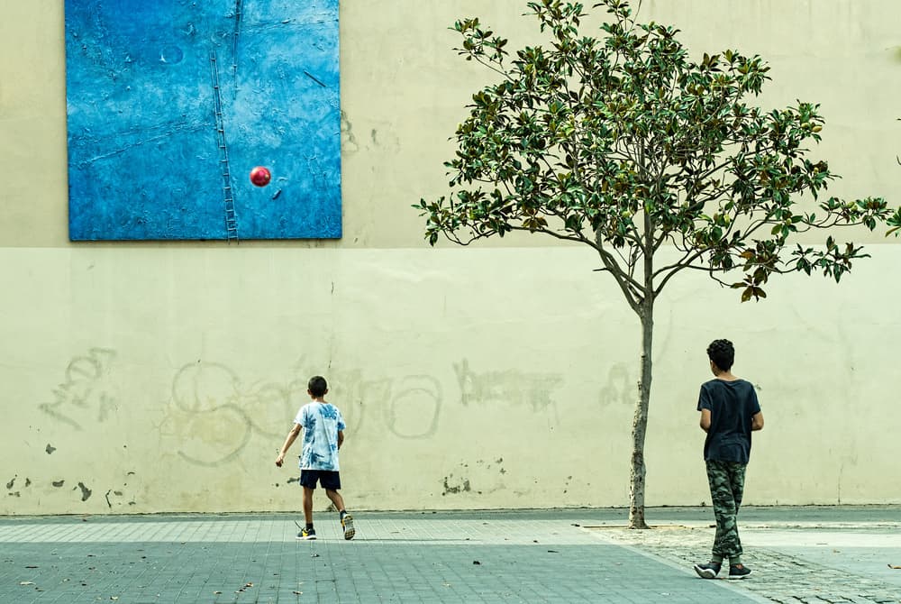 Red Ball Urban Play by Fred Barrington — canvas wall art