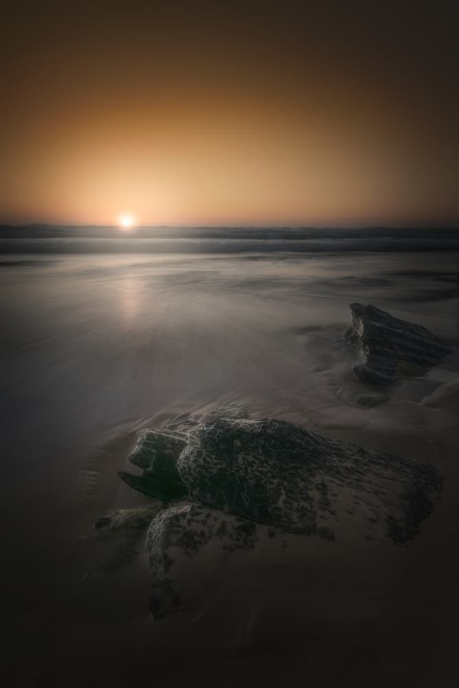 Sunset Over Beach Rocks by Marco Bruna — canvas wall art