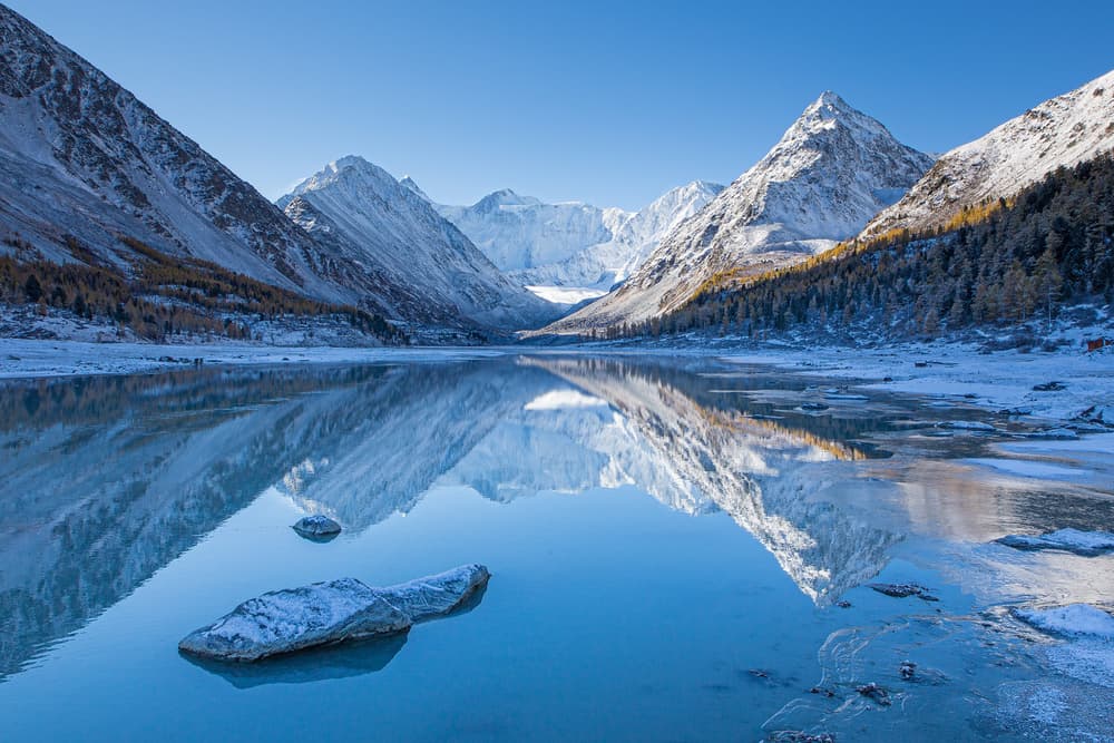 Snowy Mountain Lake Reflection by Stanislav Aristov — canvas wall art