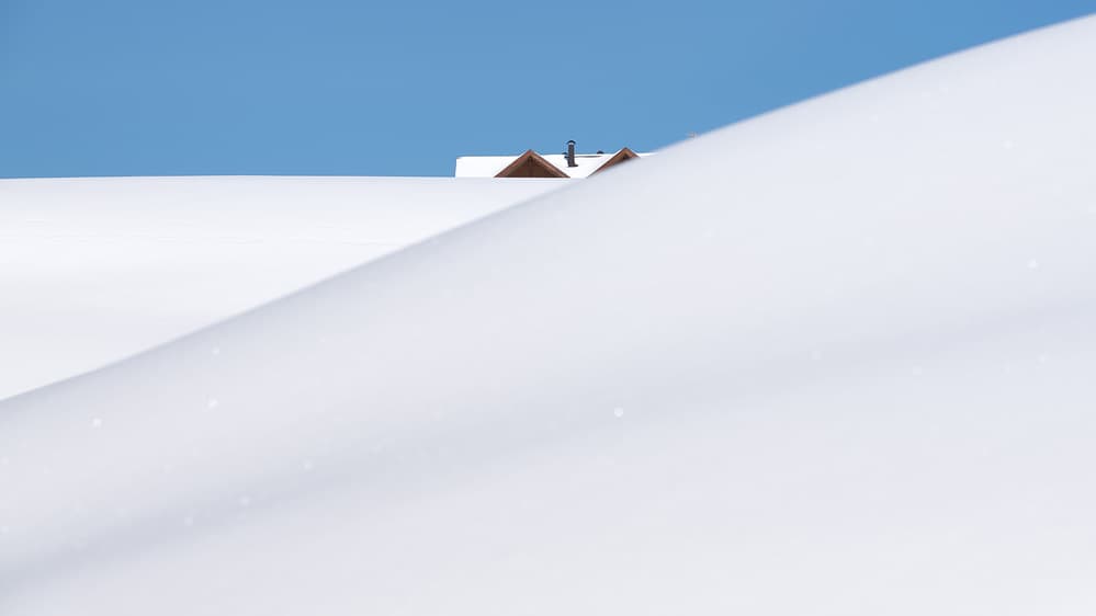 Snowy Rooftops Blue Sky by Vito Miribung — canvas wall art