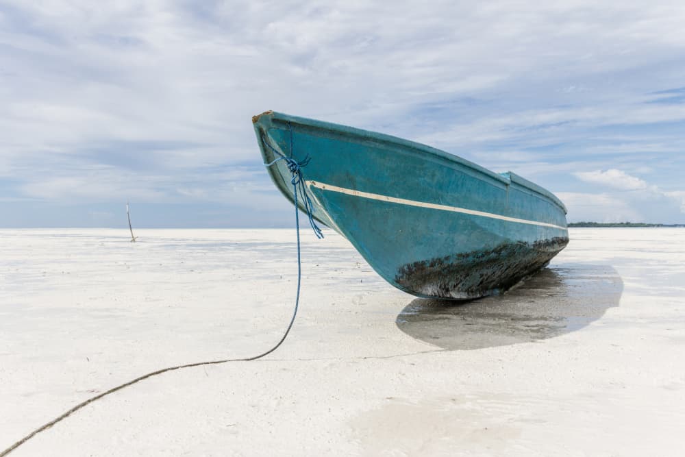 Tranquil Blue Boat Beach by Photolovers — canvas wall art