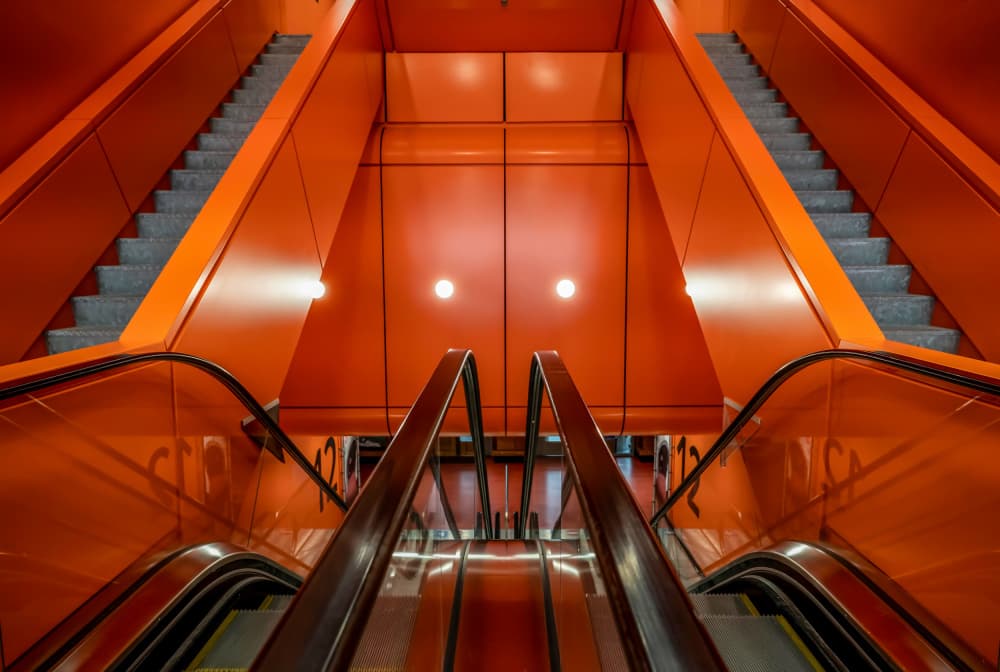 Vibrant Orange Escalators by Jaap Koer — canvas wall art