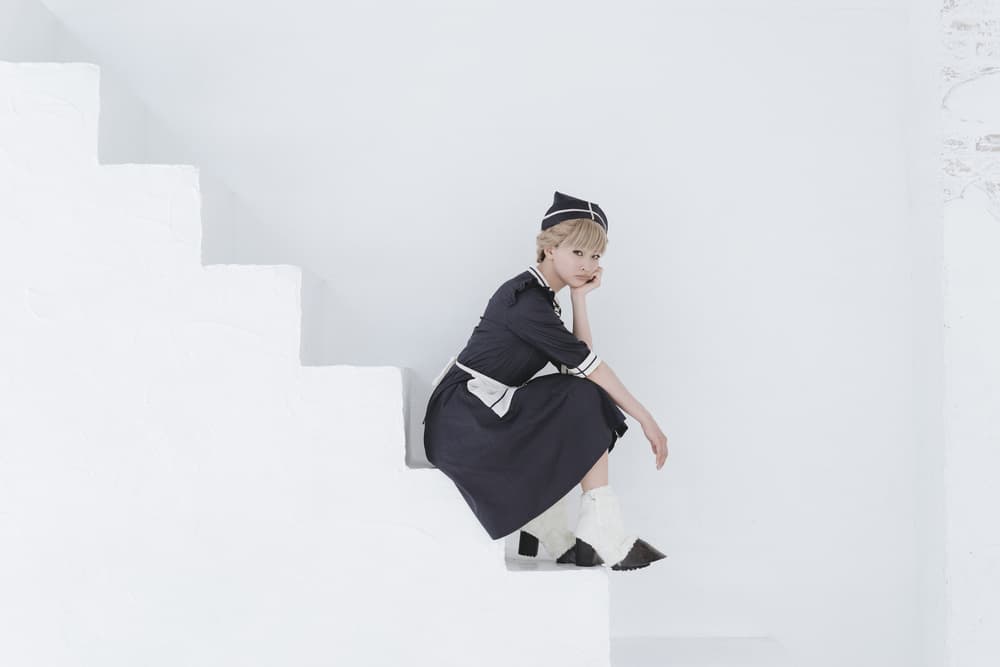 Pensive Blonde on White Stairs by Suzuhiko Suzuki — canvas wall art