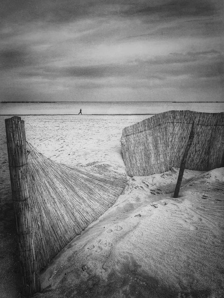 Solitary Beach Walk by Emilian Avramescu — canvas wall art