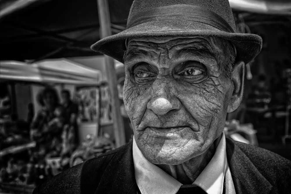 Weathered Man in Fedora by Carmen Watkins — canvas wall art