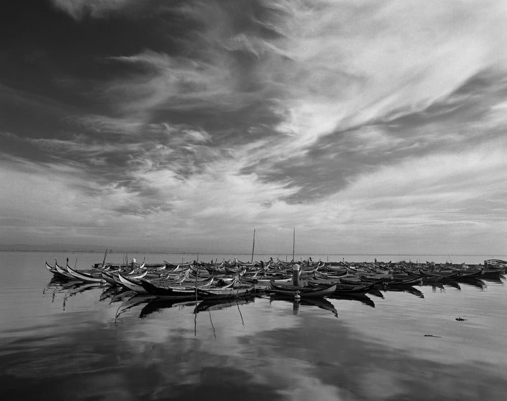 Boats and Serene Reflections by Nana Sousa Dias — canvas wall art