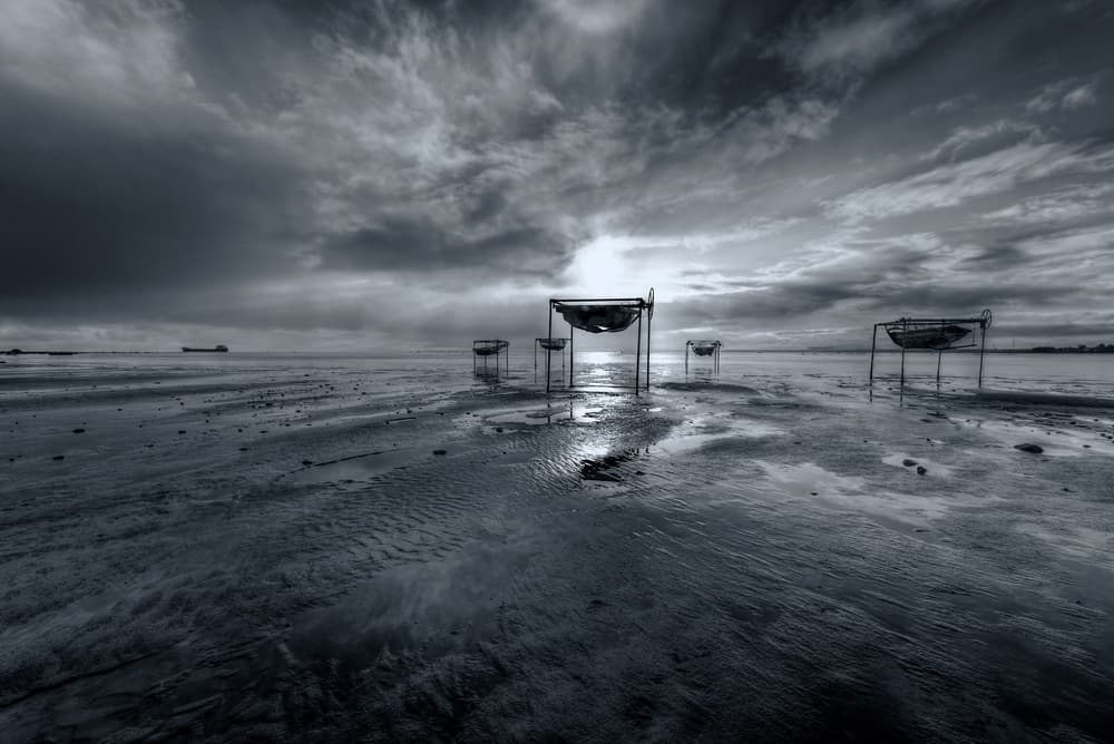 Monochrome Beach Boats by Konstantin Selezenev — canvas wall art
