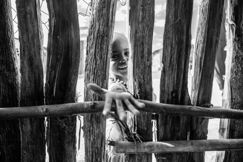 Smiling Child Through Fence by Svetlin Yosifov — canvas wall art