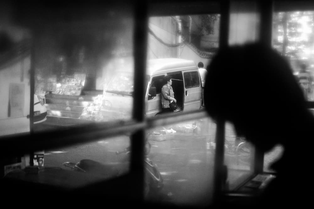 Street Life Through Window by Imaginative — canvas wall art