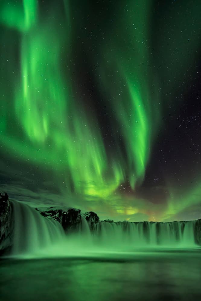 Glowing Northern Lights Waterfall by Hua Zhu — canvas wall art