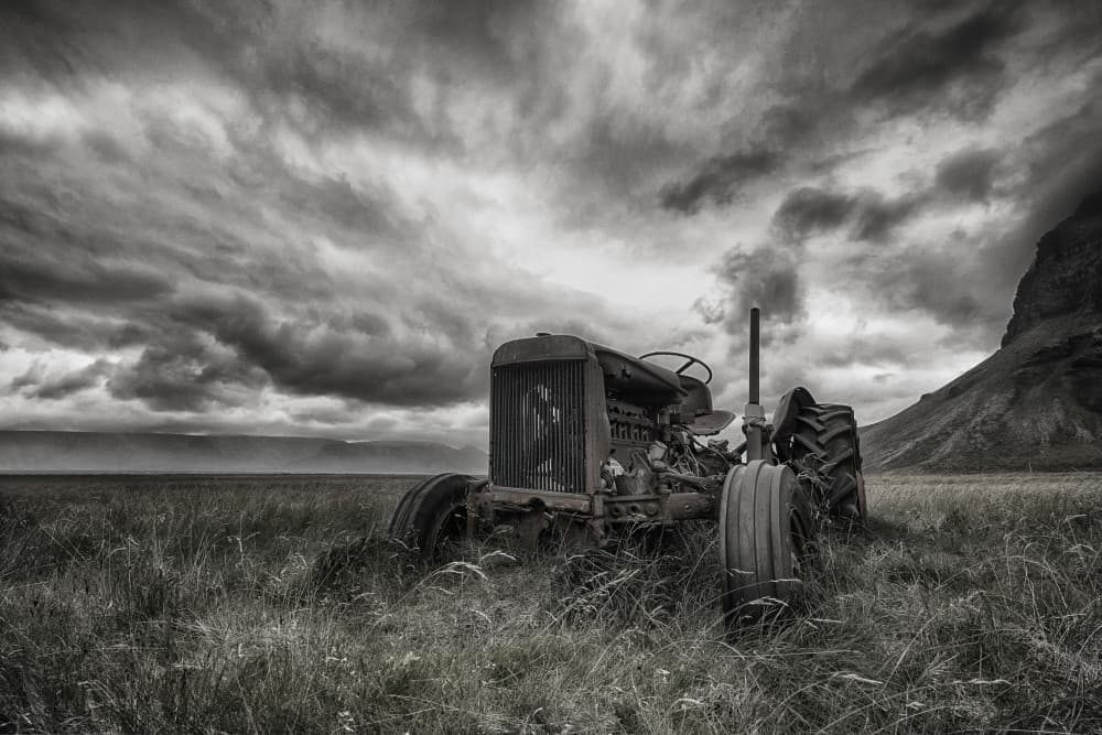 Old Tractor Stormy Sky by Þorsteinn H. Ingibergsson — canvas wall art