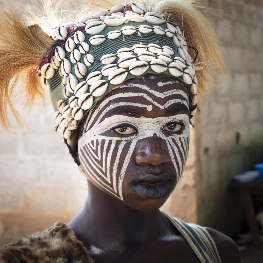 snake girl at Diourouzon village, in the mountains of Man, Ivory Coast by Elena Molina — canvas wall art