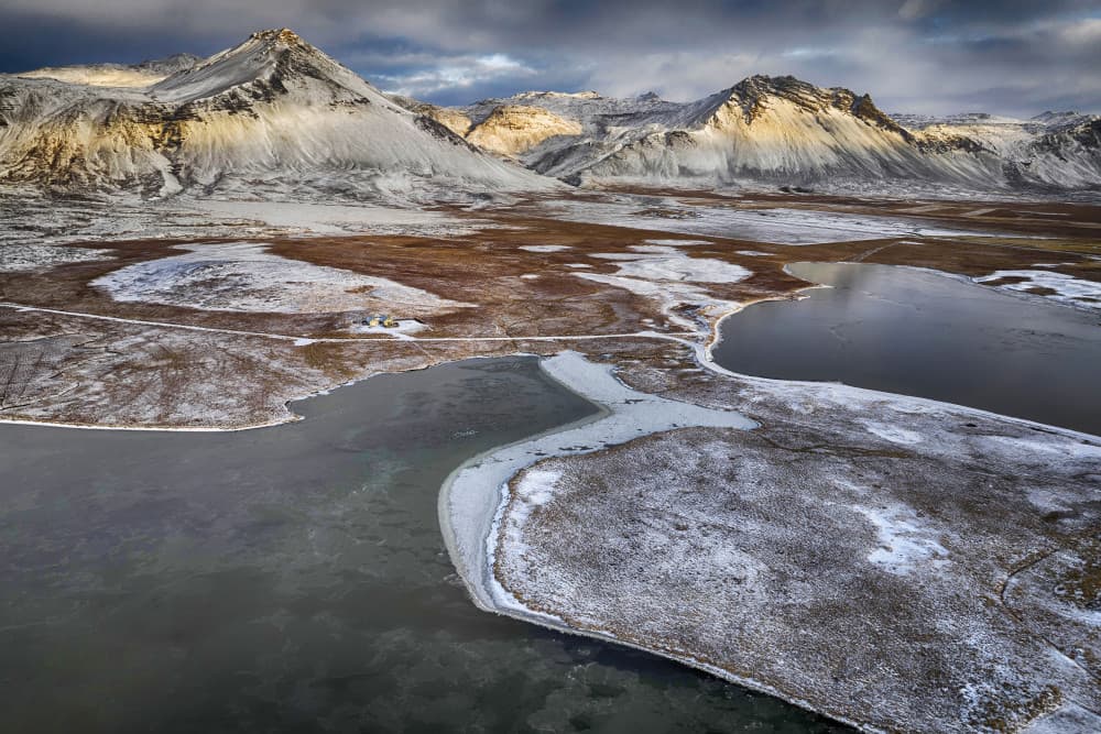 Sunlit Winter Mountain Lake by Þorsteinn H. Ingibergsson — canvas wall art