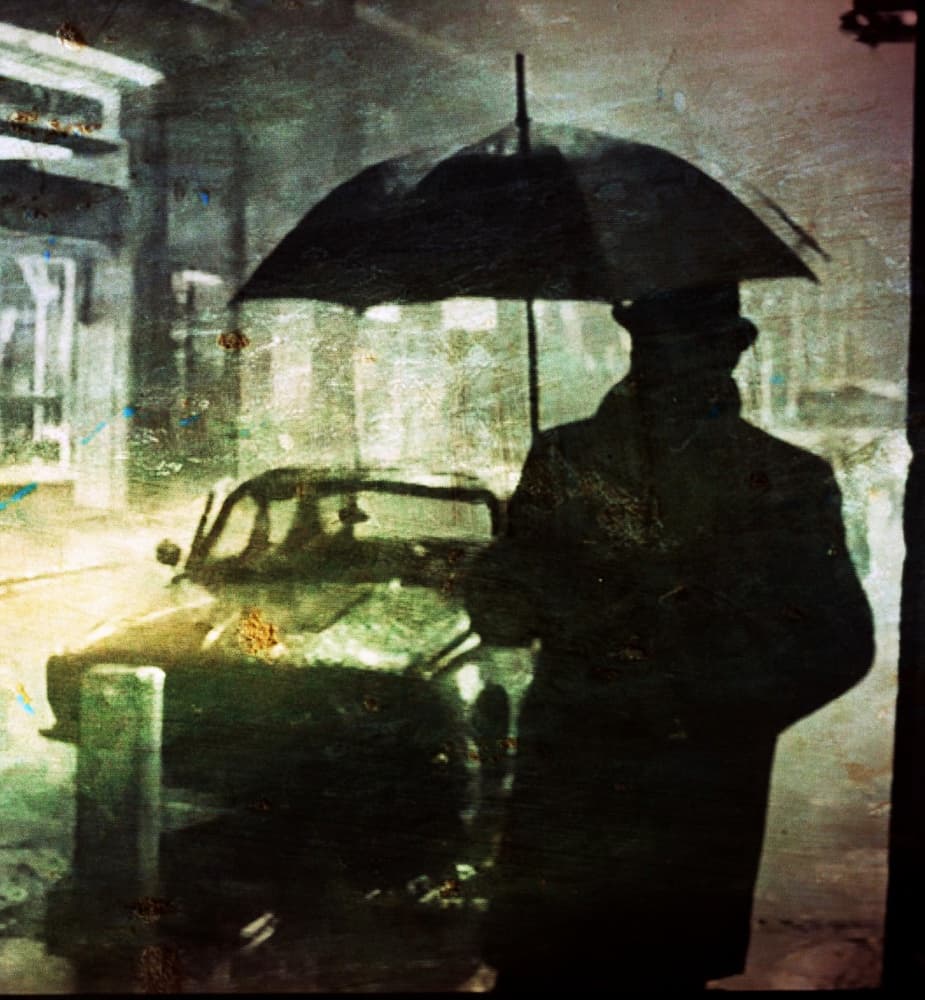 Man in Rainy City by Pe Be — canvas wall art