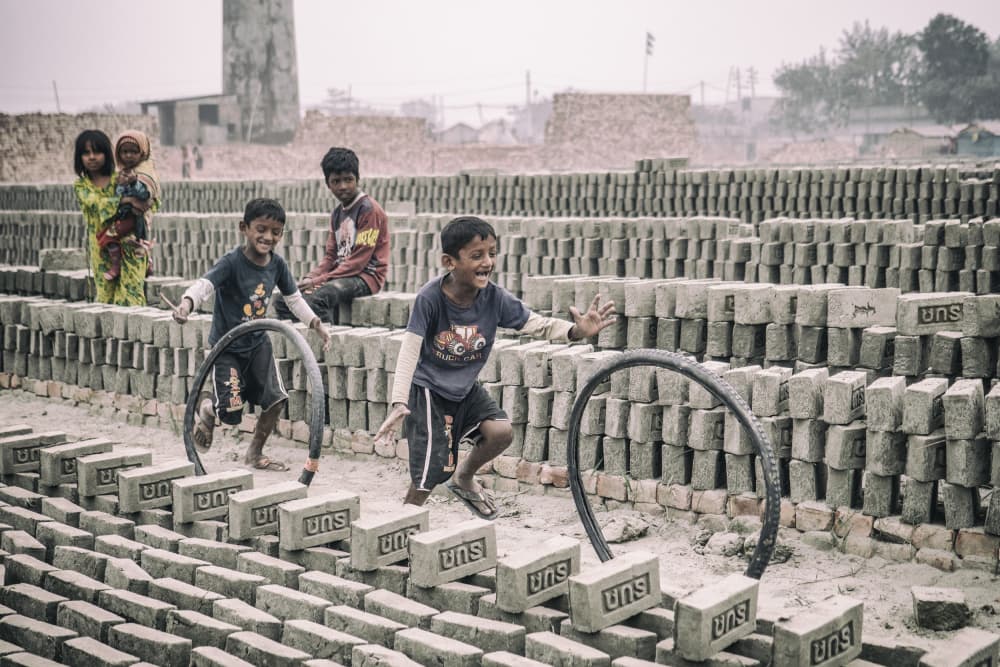 Kids Playing in Brickyard by Marcel Rebro — canvas wall art