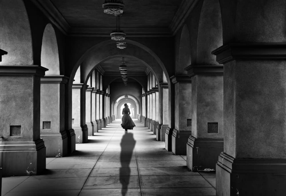 Elegant Woman Arched Hallway by LARRY BUTTERWORTH — canvas wall art
