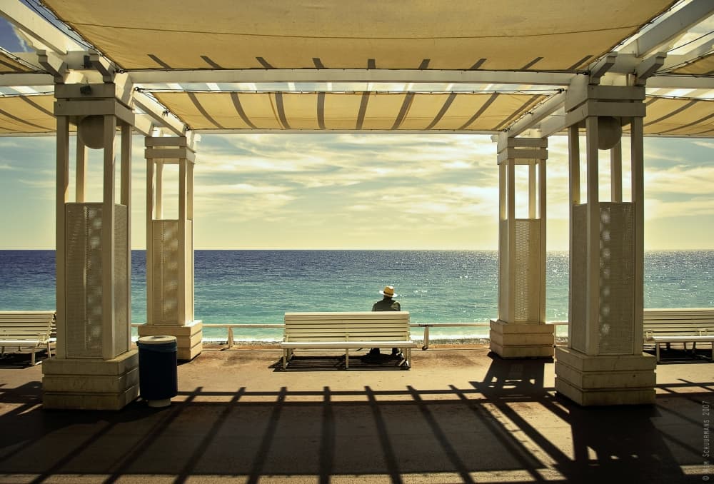 Man Relaxing Ocean View by Wim Schuurmans — canvas wall art