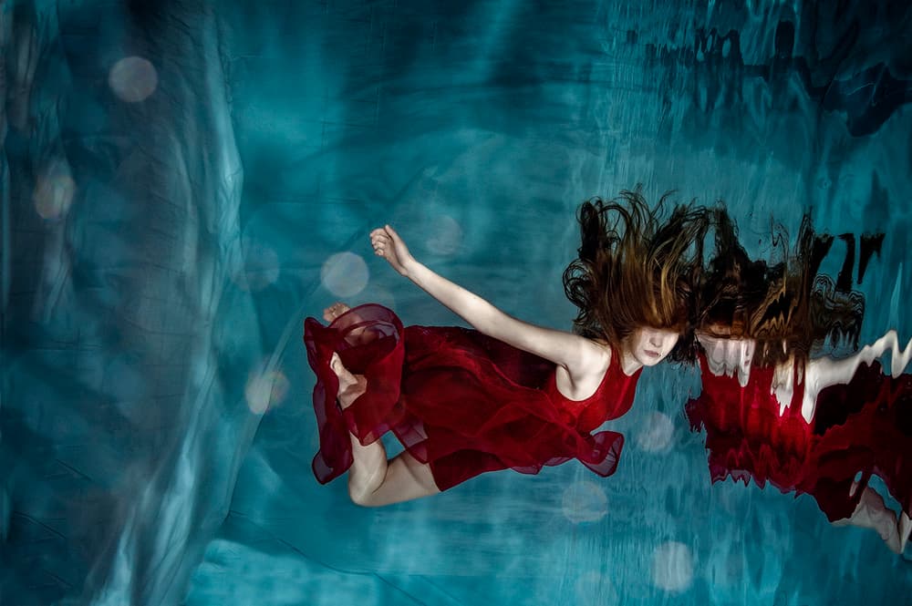 Woman In Red Underwater by Petr Kleiner — canvas wall art