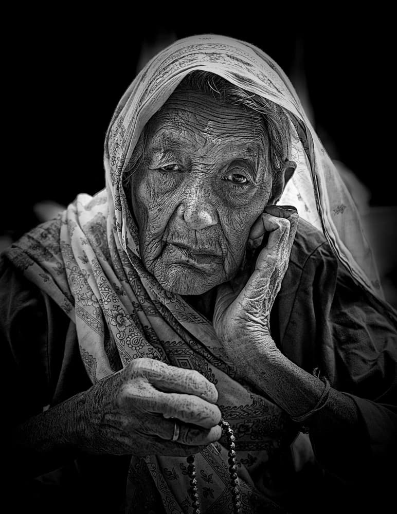 Contemplative Elderly Woman by Shaibal Nandi — canvas wall art