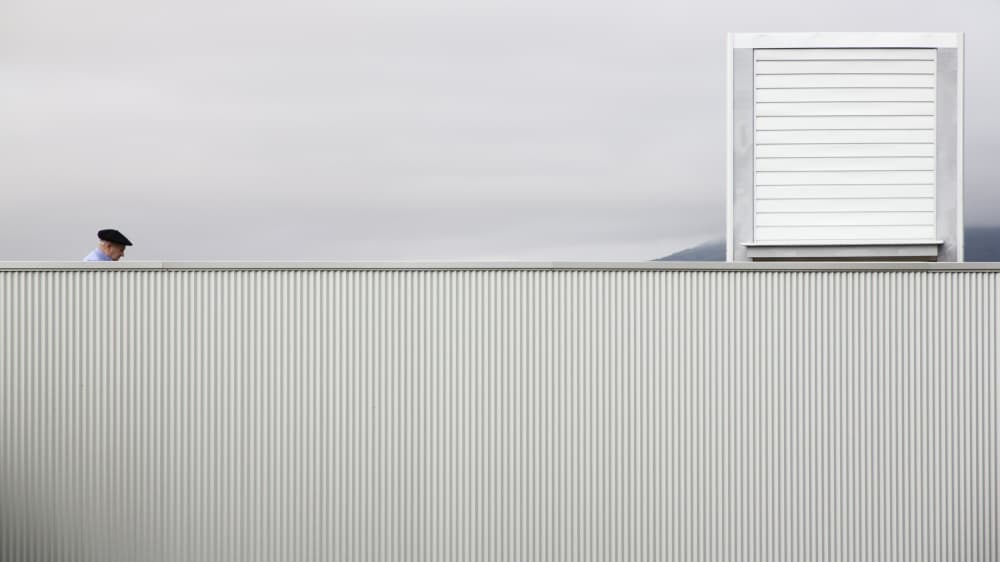 Beret Man Grey Wall by Kike Balenzategui — canvas wall art