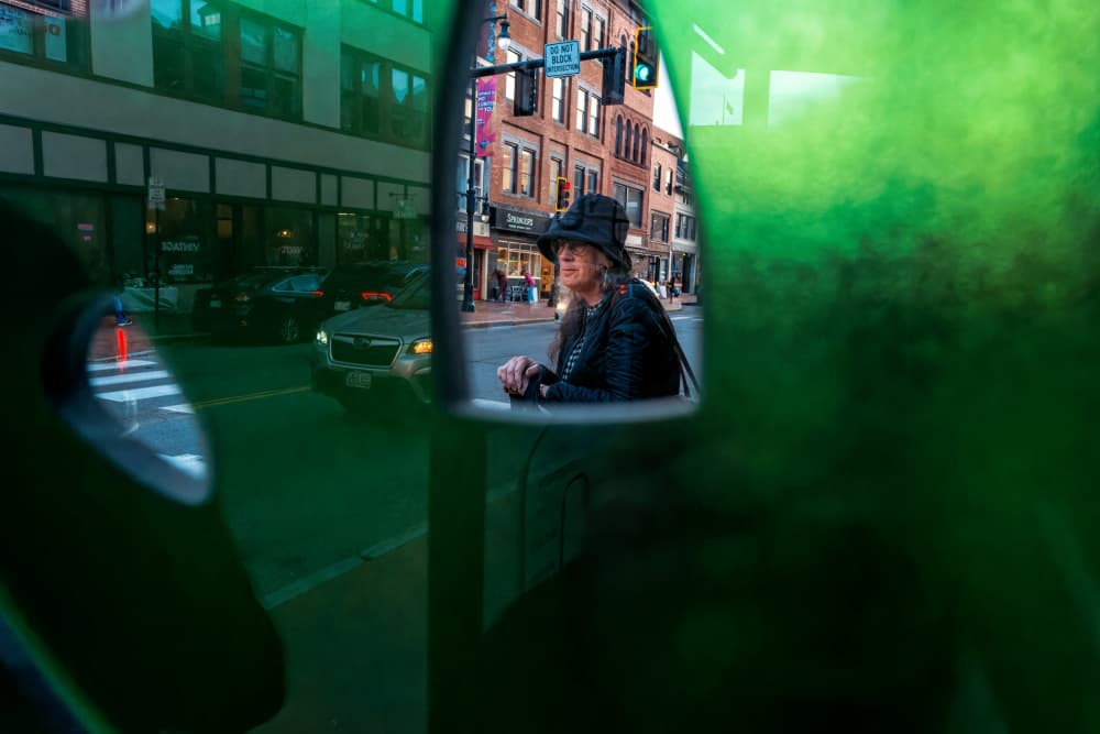 Woman in City Mirror by John Hoey — canvas wall art