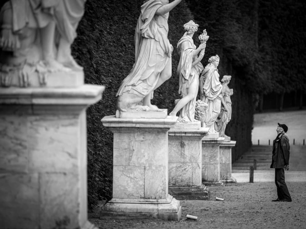 Man Among Classical Statues by Fernando Silveira — canvas wall art