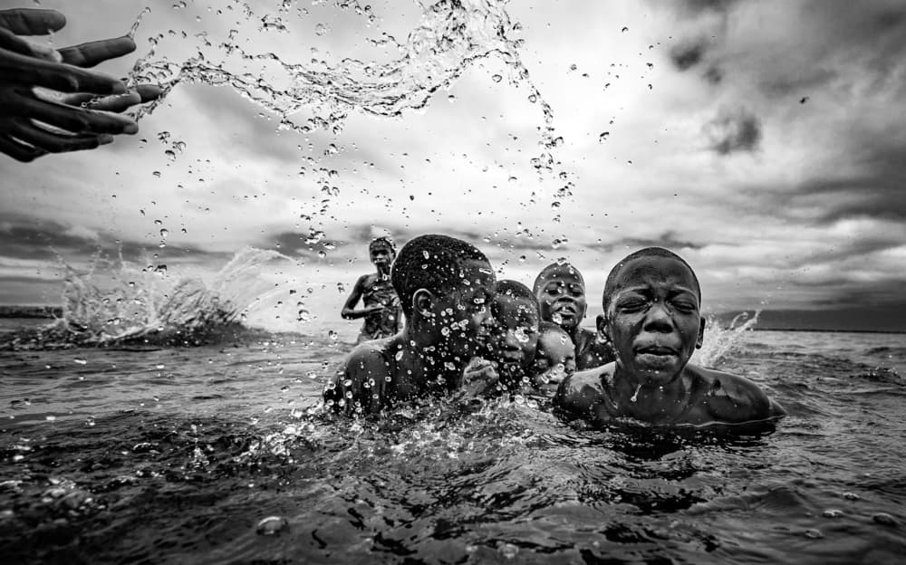 Joyful Boys Splashing by João Coelho — canvas wall art