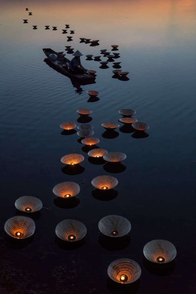 Floating Lanterns at Dusk by Sarawut Intarob — canvas wall art