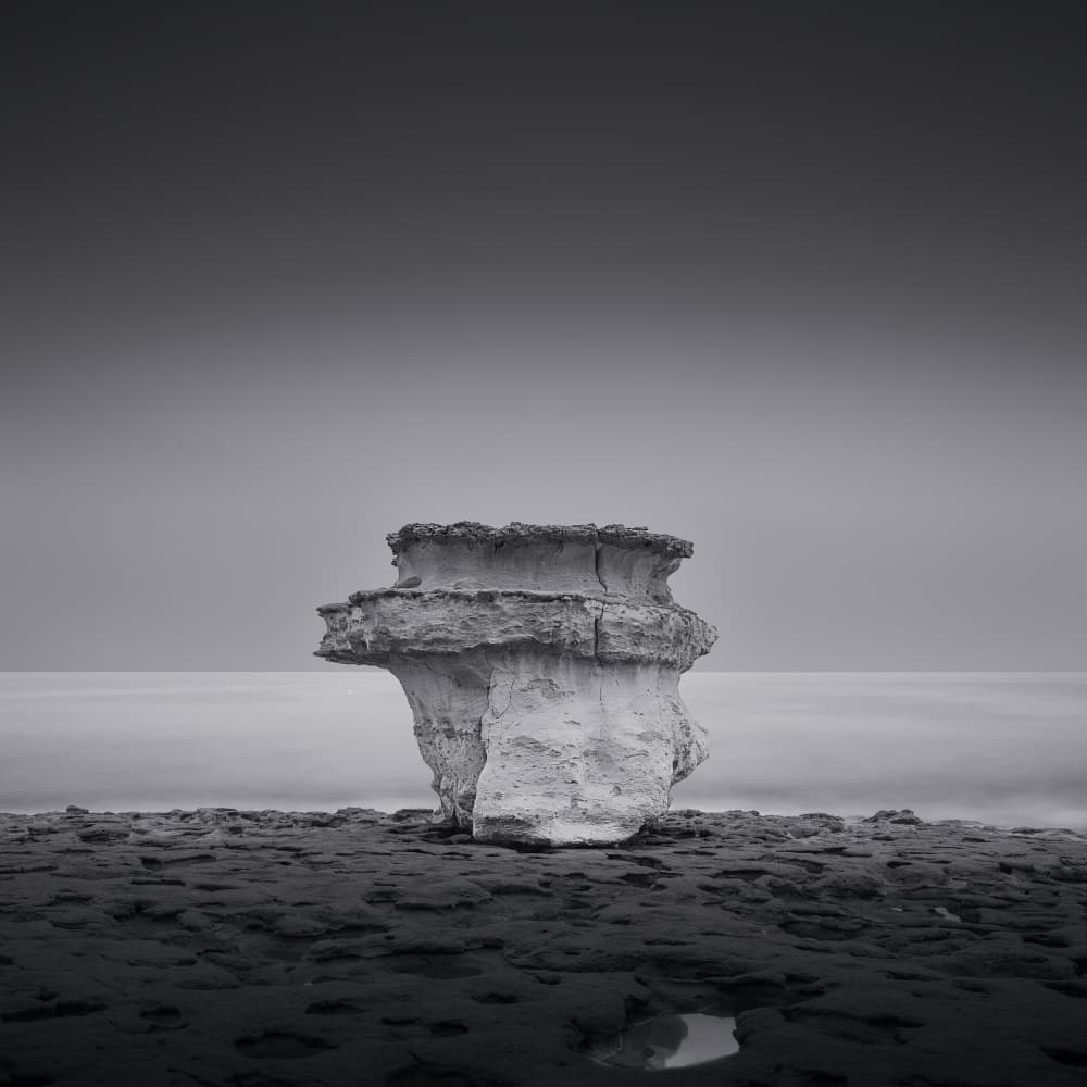 Monochrome Coastal Rock by JG.Heckelmann — canvas wall art