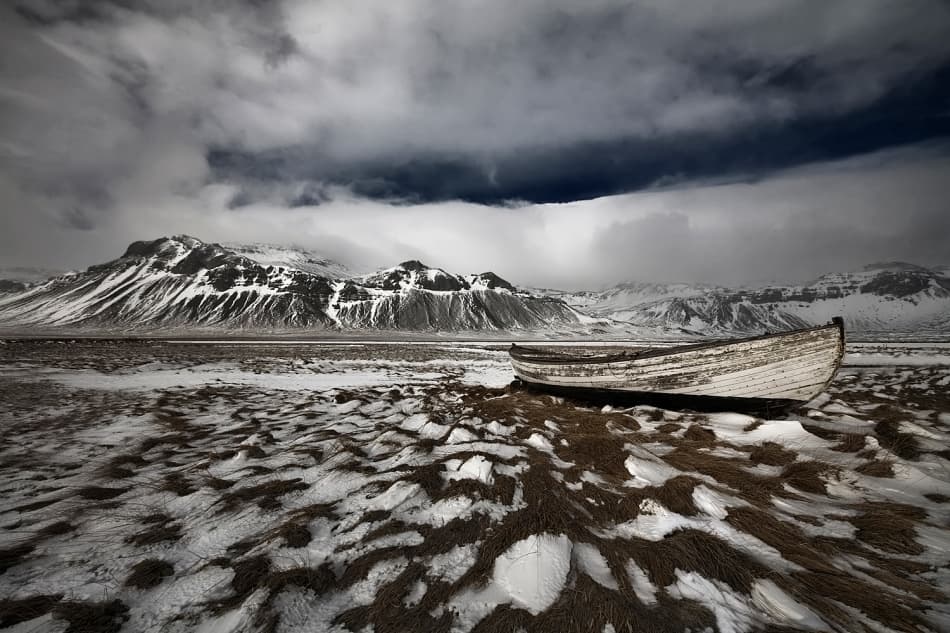 Stranded Boat Winter Mountains by Bragi Ingibergsson - BRIN — canvas wall art