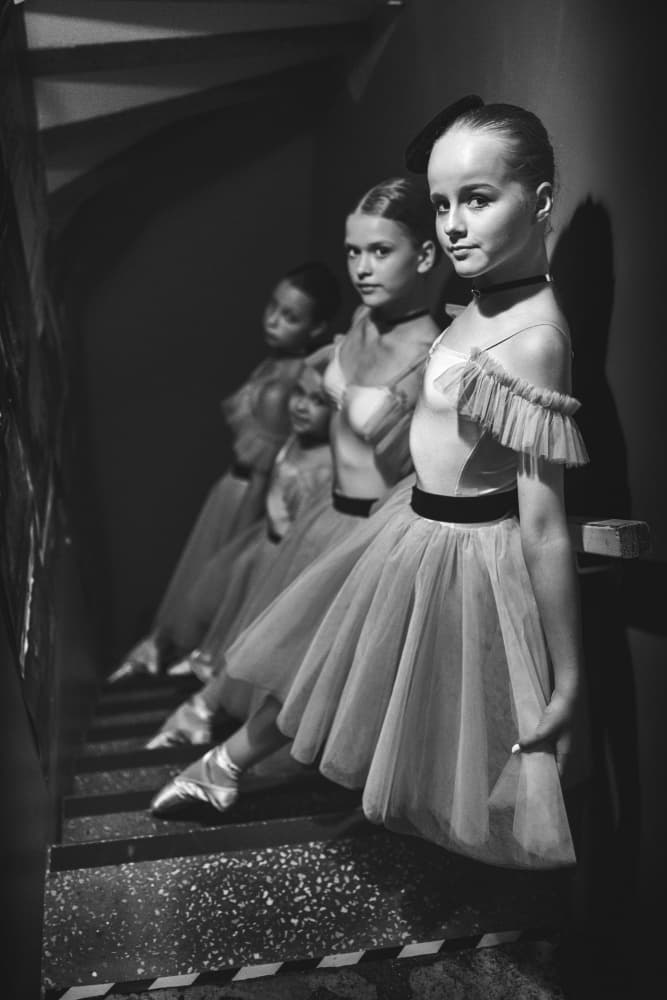 Young Ballerinas On Steps by Normunds Kaprano — canvas wall art