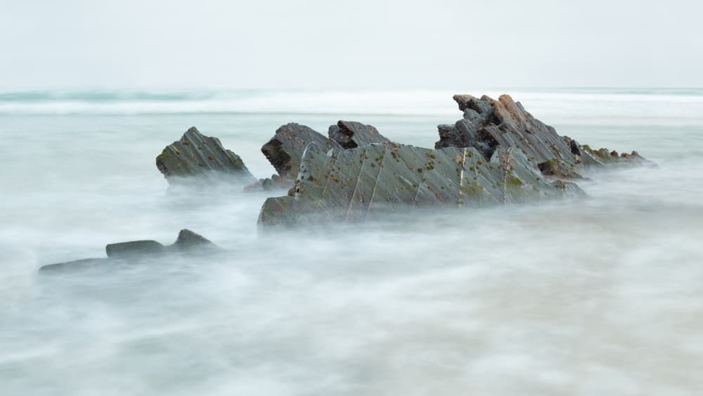 Misty Ocean Rocks by Nuno Borges — canvas wall art